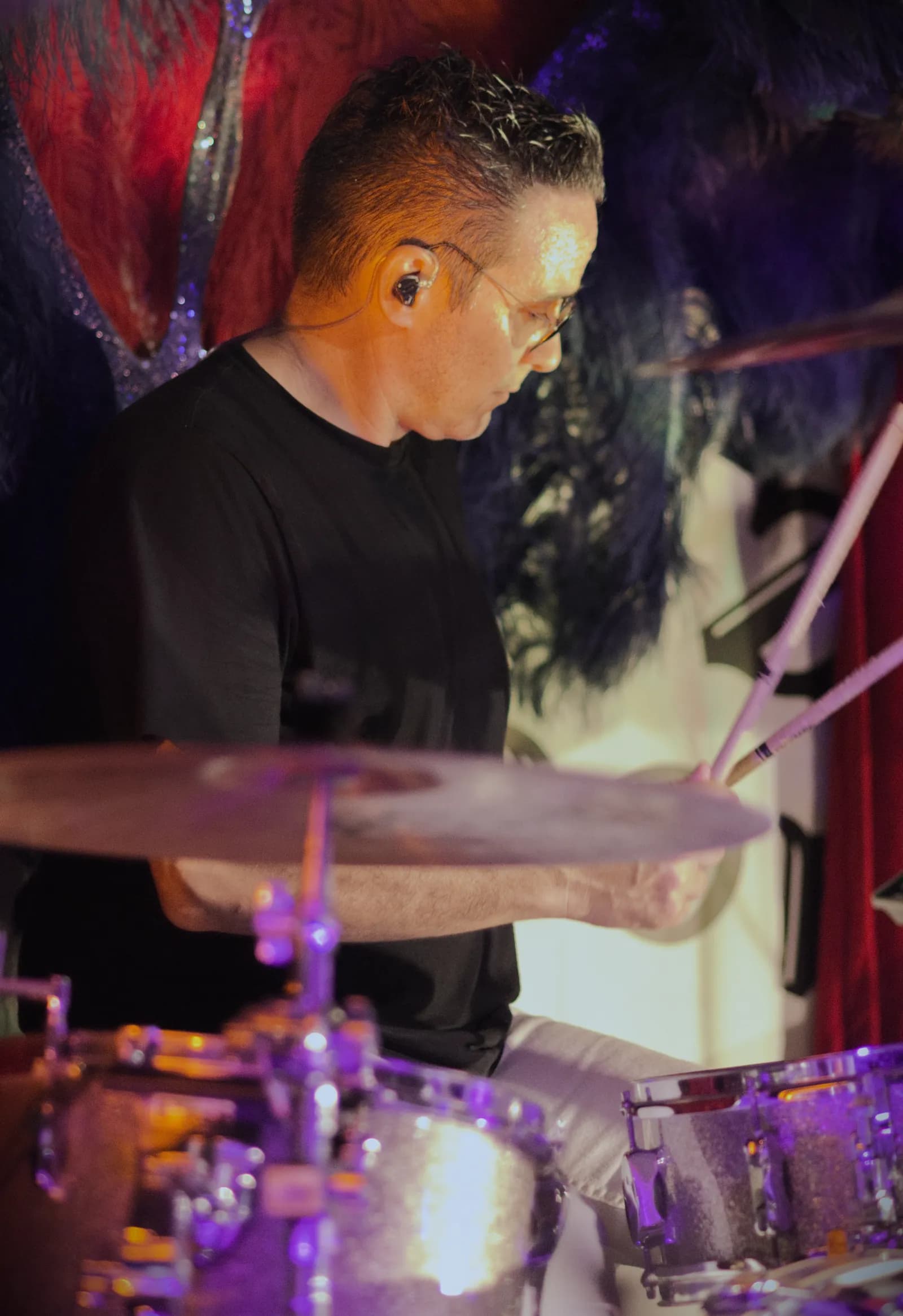 Notorious drummer mid-performance behind the kit
