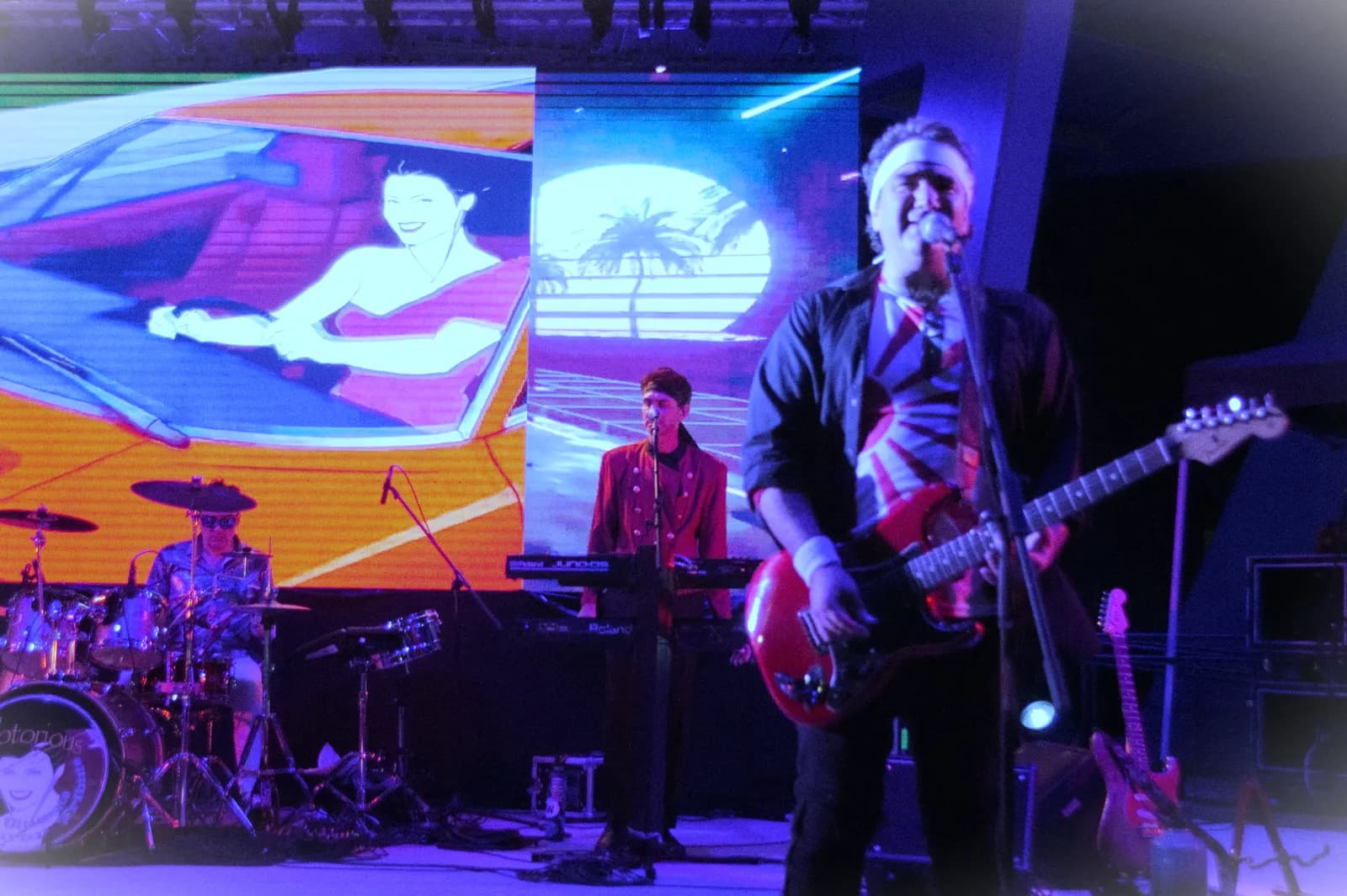 Notorious on stage with Rio-era video art behind them