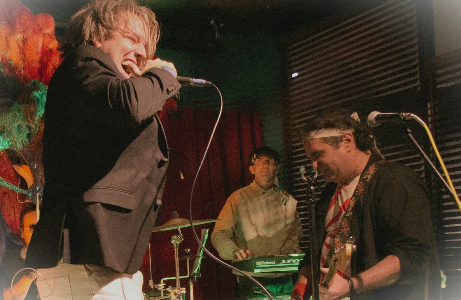 Wide shot of Notorious performing with keys and bass